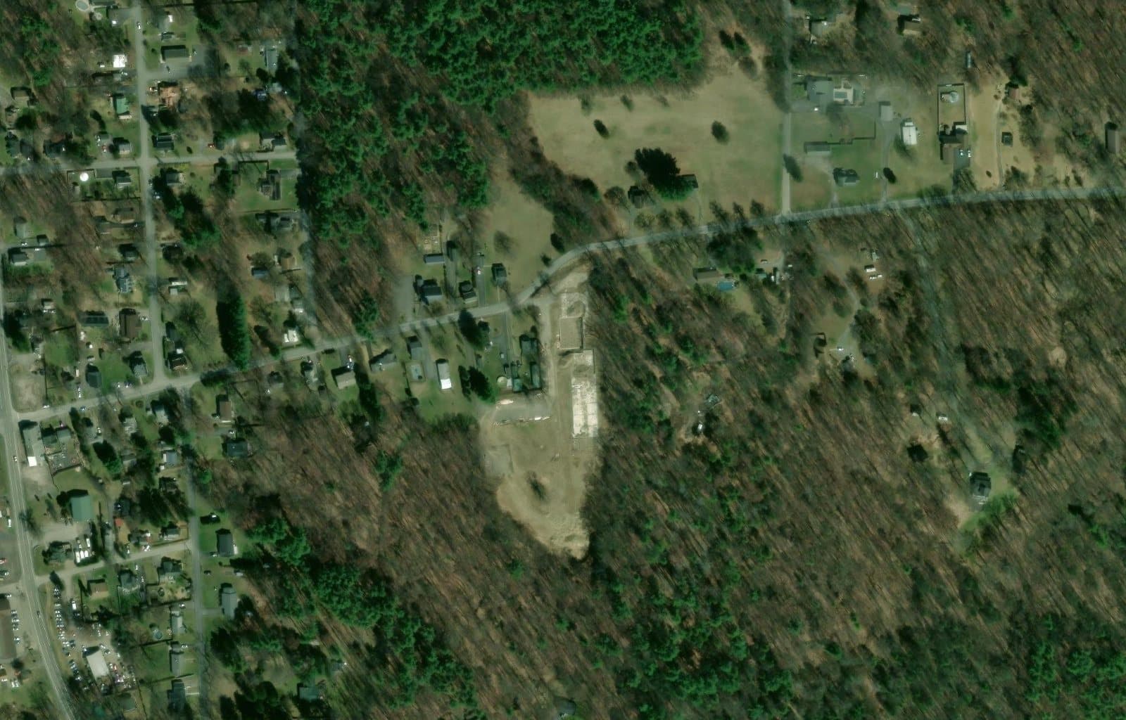 Close aerial view of the Tillson Woods wooded site and surrounding streets.